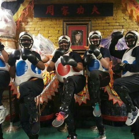 Four adults geared up for sparring.