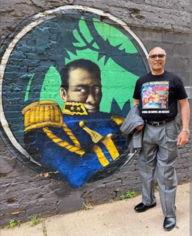 Paul Robeson mural displays Paul Robeson in Emperor Jones, a Eugene O'Neil tragic play, and next to him standing tall is Sifu Abdur Rahim Muhammad. 